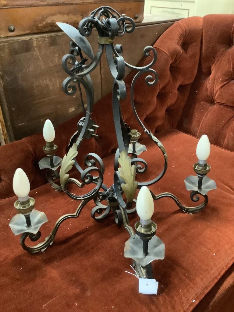 A wrought iron electrolier, height 54cm together with a wall sconce